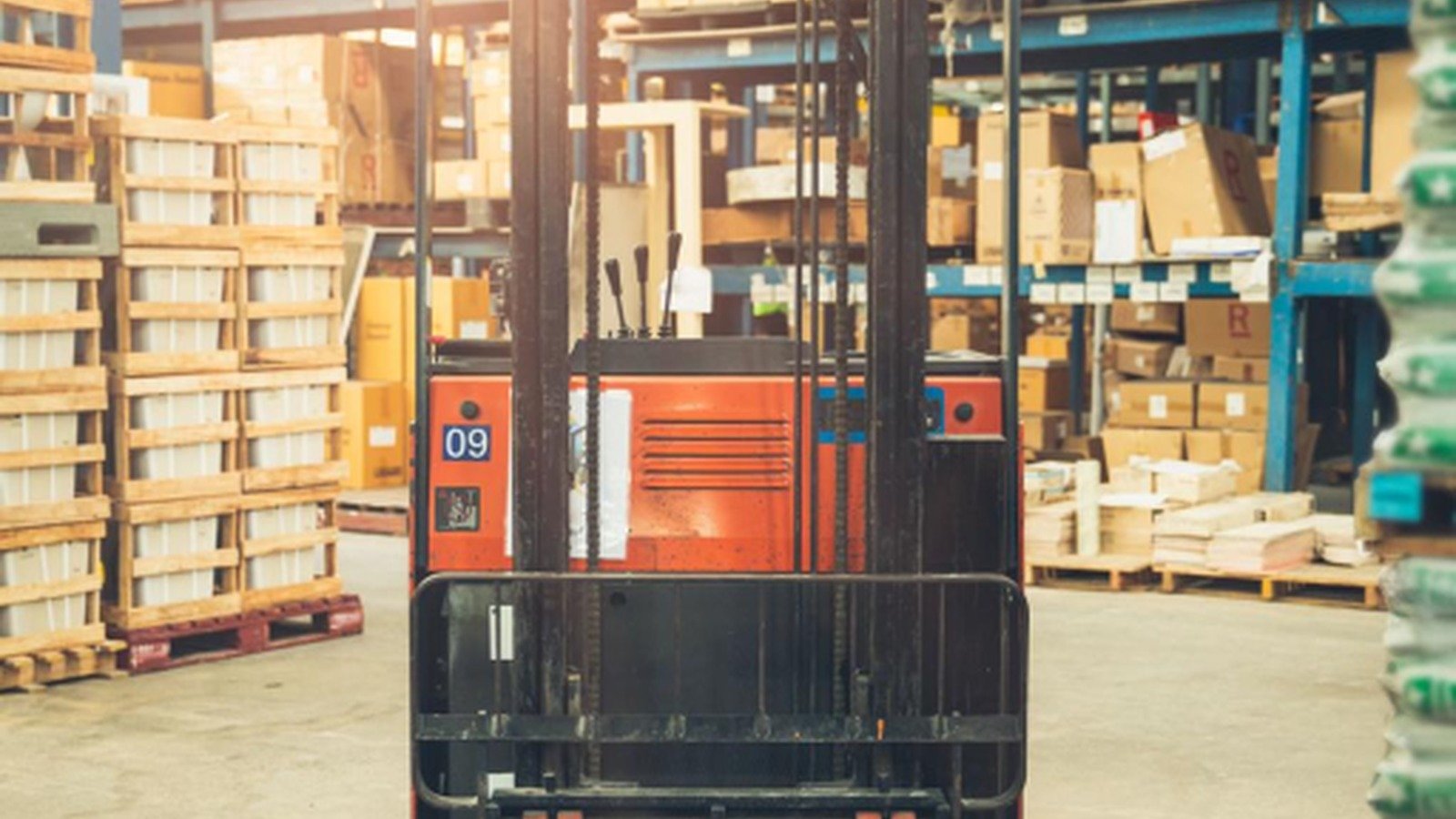 Forklift moving cartons in a USA warehouse